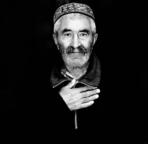 Wakhi man gives traditional greeting