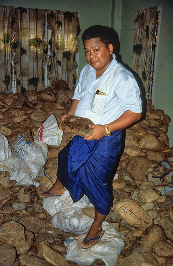 A room with a view U Tin Ngwe, who went from taxi driver to jade kingpin almost overnight, stands atop a small fortune of jade at his Hpakan home.